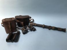 A Watson and Sons sighting scope, a pair of Ross binoculars etc.