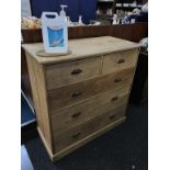 A pine five drawer chest of drawers