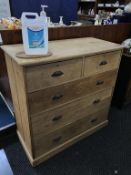 A pine five drawer chest of drawers