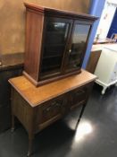 An oak wash stand and a small glazed cabinet