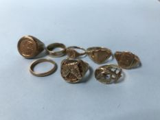 Seven 9ct gold rings (23g), and an 18ct gold ring