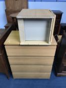 An Ikea chest of drawers and bedside cabinet