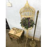 A nest of tables with onyx tops, and a birdcage etc.