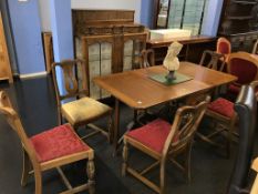 A Lees style oak gateleg table, six chairs and matching china cabinet