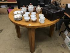 A circular oak dining table