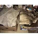 Two boxes of fur coats