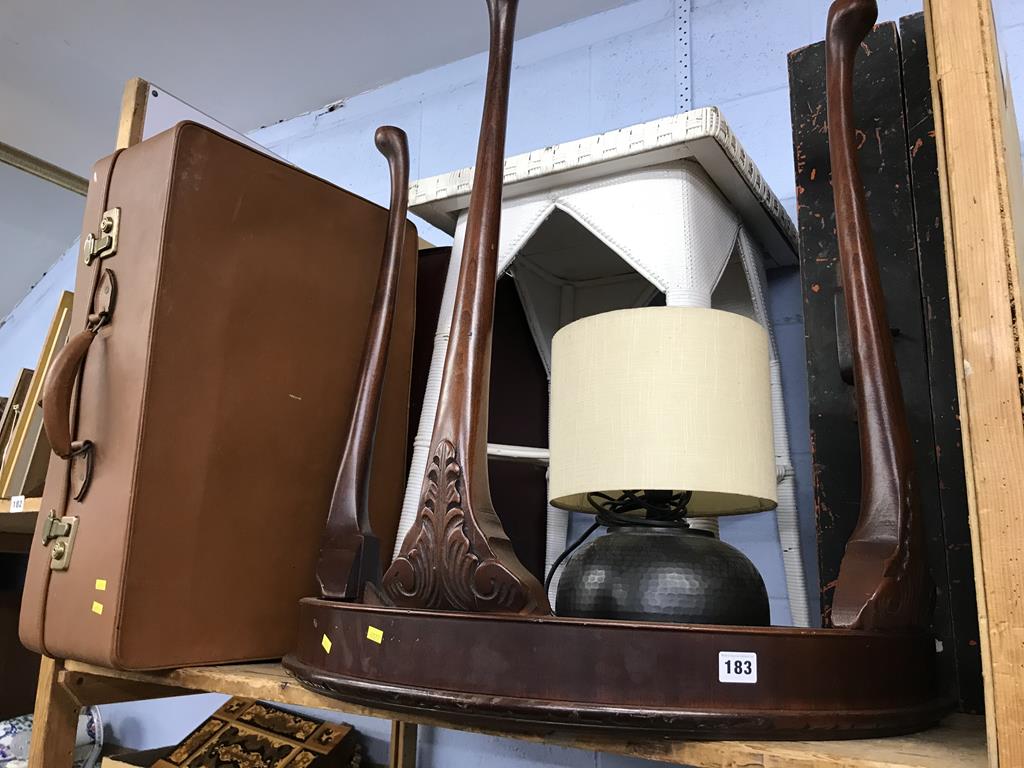 A shelf of assorted, to include a trunk and lamp etc.