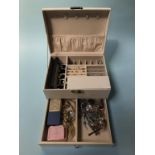 A jewellery box containing various earrings etc.