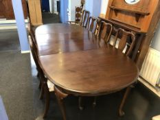 A mahogany extending dining table and eight chairs (2 + 6)