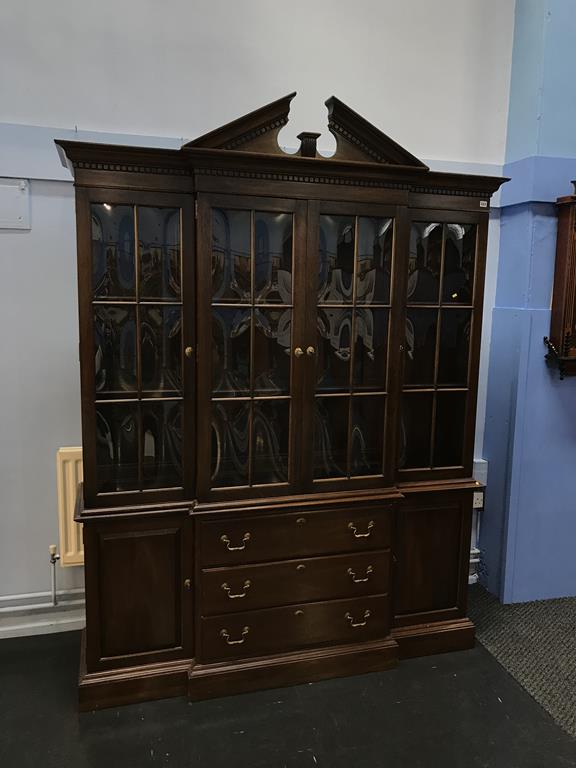 A reproduction mahogany breakfront book case