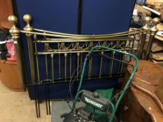 A pair of brass bed ends