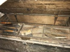 A large wooden tool chest and contents