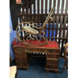 A mahogany plastic desk and a Bentwood rocking chair