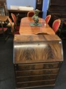 An elm table and six chairs, a reproduction bookcase and a reproduction bureau