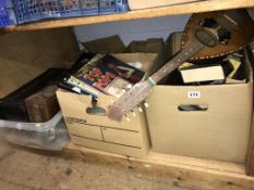 Four boxes of assorted, to include books and musical instruments etc.
