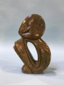 An abstract stone sculpture, signed Zachariah Njobo