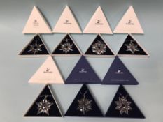 Seven boxed Swarovski Christmas ornaments