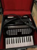 A Chamson accordion, in hard case