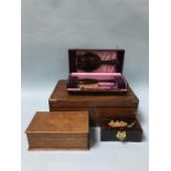 A Rosewood writing slope, two boxes and a boxed vanity set