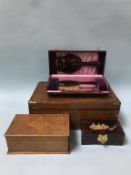 A Rosewood writing slope, two boxes and a boxed vanity set