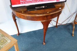 A walnut half moon side table, with segmented and crossbanded top, 108cm width