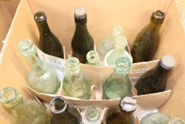 Four boxes of antique bottles etc.