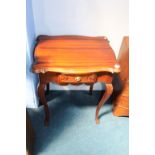 A reproduction mahogany side table