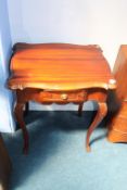 A reproduction mahogany side table