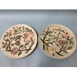 A pair of Austrian wall plaques, decorated with flowers, impressed number 609, 37cm diameter