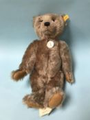 A Steiff 'Classic' caramel mohair Teddy Bear, with yellow tag, number 004612, chest tag and swing