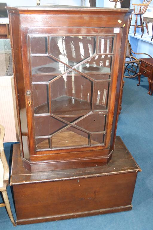 A pine trunk and a 19th century mahogany corner cabinet