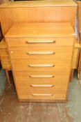 A teak chest of drawers, blanket box and a desk