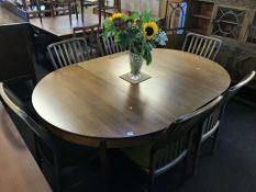 A Danish teak extending dining table and a set of six chairs by Svend Madsen, 240cm x 120cm