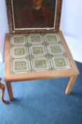 A teak and tiled square coffee table