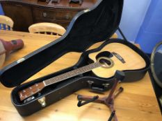 A Johnson electric guitar with hard case and stand, serial number JAG 660 OEQ-N