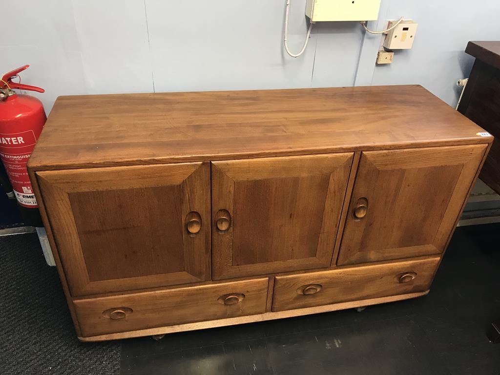 An Ercol Golden Dawn sideboard