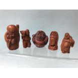 A collection of five carved boxwood netsukes