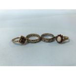Three 9ct gold rings (9g), and one other