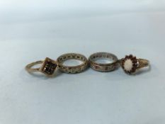 Three 9ct gold rings (9g), and one other