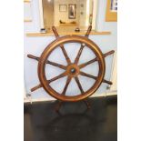 A large mahogany Ships wheel, 138cm diameter