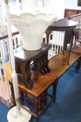 A half moon table, standard lamp, Ercol nest of tables etc.