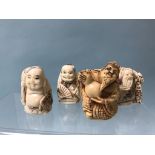 A collection of three bone netsukes and one resin (4)