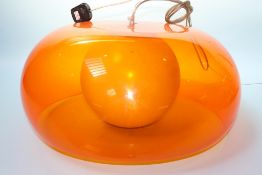 Three orange Perspex light fittings