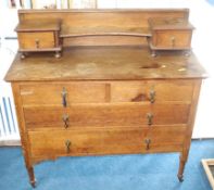 An oak chest of drawers