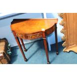 A reproduction mahogany side table and an oak coat rack