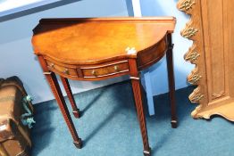 A reproduction mahogany side table and an oak coat rack