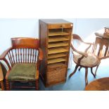 A 1930's oak tambour fronted filing drawer and two office chairs