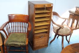 A 1930's oak tambour fronted filing drawer and two office chairs