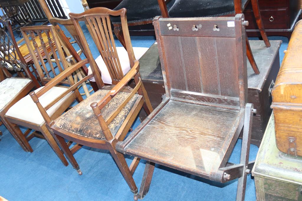 A mahogany carver chair and an oak hall chair