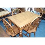 A kitchen table with four Windsor chairs